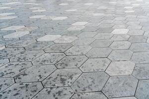 The texture of hexagonal tiled pavement with perspective. photo