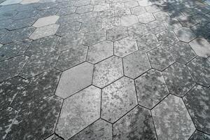 The texture of hexagonal tiled pavement with perspective. photo