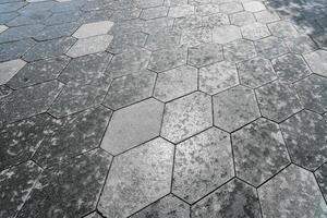 The texture of hexagonal tiled pavement with perspective. photo