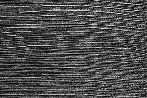 The texture of a black artificial plank. photo