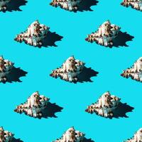Seamless pattern of clam shells on a cyan background. photo