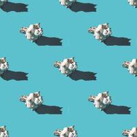 Seamless pattern of clam shells on a cyan background. photo
