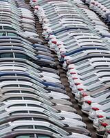 Rows of a new cars parked in a distribution center of a car factory. photo
