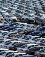 Volkswagen Group Rus, Russia, Kaluga - MAY 25, 2020 Rows of a new cars parked in a distribution center on a sunny day in the sprin. photo