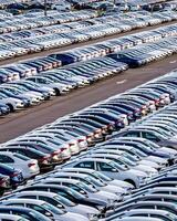 Volkswagen Group Rus, Russia, Kaluga - MAY 25, 2020 Rows of a new cars parked in a distribution center on a sunny day in the spring photo