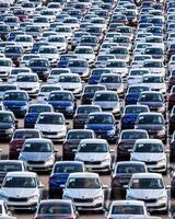 Volkswagen Group Rus, Russia, Kaluga - MAY 25, 2020 Rows of a new cars parked in a distribution center on a sunny day in the spring photo
