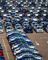 Volkswagen Group Rus, Russia, Kaluga - MAY 25, 2020 Rows of a new cars parked in a distribution center on a sunny day in the spring photo