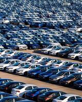 Volkswagen Group Rus, Russia, Kaluga - MAY 25, 2020 Rows of a new cars parked in a distribution center on a sunny day in the spring photo