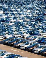 Volkswagen Group Rus, Russia, Kaluga - MAY 25, 2020 Rows of a new cars parked in a distribution center on a sunny day in the spring photo