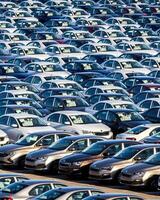 Volkswagen Group Rus, Russia, Kaluga - MAY 25, 2020 Rows of a new cars parked in a distribution center on a sunny day in the spring photo