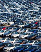 Volkswagen Group Rus, Russia, Kaluga - MAY 25, 2020 Rows of a new cars parked in a distribution center on a sunny day in the spring photo