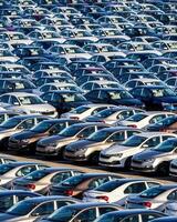 Volkswagen Group Rus, Russia, Kaluga - MAY 25, 2020 Rows of a new cars parked in a distribution center on a sunny day in the spring photo