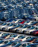 Volkswagen Group Rus, Russia, Kaluga - MAY 25, 2020 Rows of a new cars parked in a distribution center on a sunny day in the spring photo
