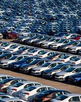 Volkswagen Group Rus, Russia, Kaluga - MAY 25, 2020 Rows of a new cars parked in a distribution center on a sunny day in the spring photo
