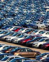 Volkswagen Group Rus, Russia, Kaluga - MAY 25, 2020 Rows of a new cars parked in a distribution center on a sunny day in the spring photo