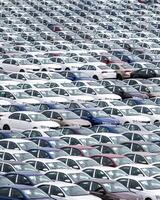 Volkswagen Group Rus, Russia, Kaluga - MAY 24, 2020 Rows of a new cars parked in a distribution center on a cloudy day in the spring, a car factory photo
