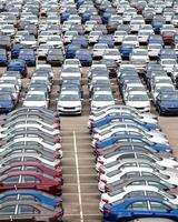 Volkswagen Group Rus, Russia, Kaluga - MAY 24, 2020 Rows of a new cars parked in a distribution center on a cloudy day in the spring, a car factory photo