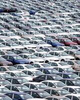 Volkswagen Group Rus, Russia, Kaluga - MAY 24, 2020 Rows of a new cars parked in a distribution center on a cloudy day in the spring, a car factory photo