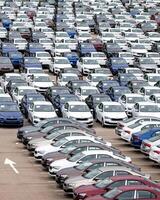 Volkswagen Group Rus, Russia, Kaluga - MAY 24, 2020 Rows of a new cars parked in a distribution center on a cloudy day in the spring, a car factory photo