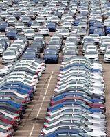 Volkswagen Group Rus, Russia, Kaluga - MAY 24, 2020 Rows of a new cars parked in a distribution center on a cloudy day in the spring, a car factory photo