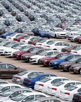 Volkswagen Group Rus, Russia, Kaluga - MAY 24, 2020 Rows of a new cars parked in a distribution center on a cloudy day in the spring, a car factory photo