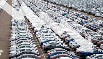 The concept of a decline in car production or prices. Manufacturing crisis or recession crisis in new car sales. photo