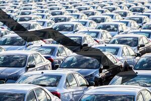 The concept of a decline in car production or prices. Manufacturing crisis or recession crisis in new car sales. photo