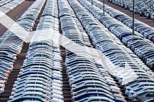 The concept of a decline in car production or prices. Manufacturing crisis or recession crisis in new car sales. photo