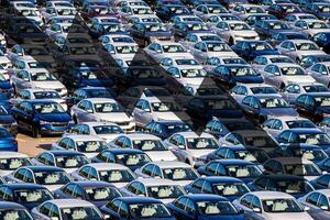 The concept of a decline in car production or prices. Manufacturing crisis or recession crisis in new car sales. photo