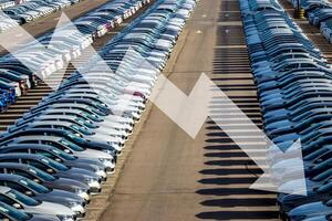 The concept of a decline in car production or prices. Manufacturing crisis or recession crisis in new car sales. photo