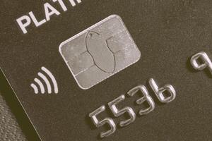 Close-up shot of a debit or credit card with a chip. photo