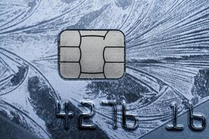Close-up shot of a debit or credit card with a chip. photo