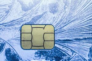 Close-up shot of a debit or credit card with a chip. photo