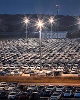 Volkswagen, Russia, Kaluga - JULY 14, 2022 New cars parked at distribution center automobile factory at night with lights. photo