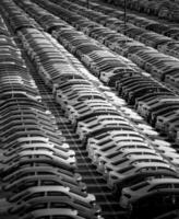 Volkswagen Group Rus, Russia, Kaluga - MAY 24, 2020 Rows of a new cars parked in a distribution center on a day in the spring, a car factory. Parking in the open air. Black and white photo. photo