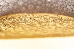 Texture of gas bubbles in light beer. photo