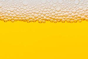 Texture of gas bubbles in light beer. photo