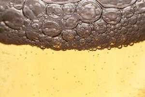 Texture of gas bubbles in light beer. photo