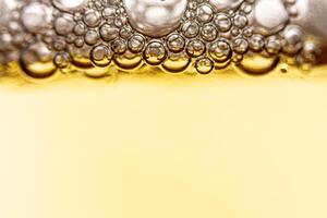 Texture of gas bubbles in light beer. photo