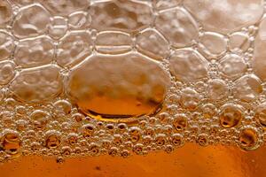 Texture of gas bubbles in light beer. photo