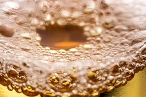 Texture of gas bubbles in light beer. photo