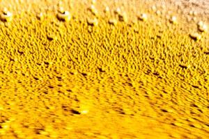 Texture of gas bubbles in light beer. photo