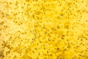 Texture of gas bubbles in light beer. photo