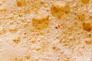 Texture of gas bubbles in light beer. photo