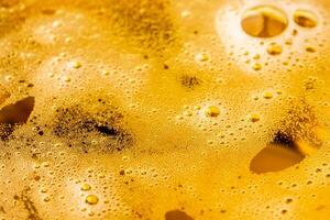 Texture of gas bubbles in light beer. photo