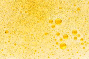 Texture of gas bubbles in light beer. photo