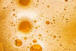 Texture of gas bubbles in light beer. photo