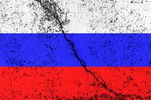 Russian Federation flag on cracked concrete wall. The concept of crisis, default, economic collapse, pandemic, conflict, terrorism or other problems in the country. Abstract disaster symbol. photo