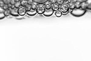 Monochrome background with air bubbles in the liquid. Gel detergents. Abstract backdrop. photo