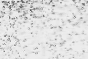 Monochrome background with air bubbles in the liquid. Gel detergents. Abstract backdrop. photo